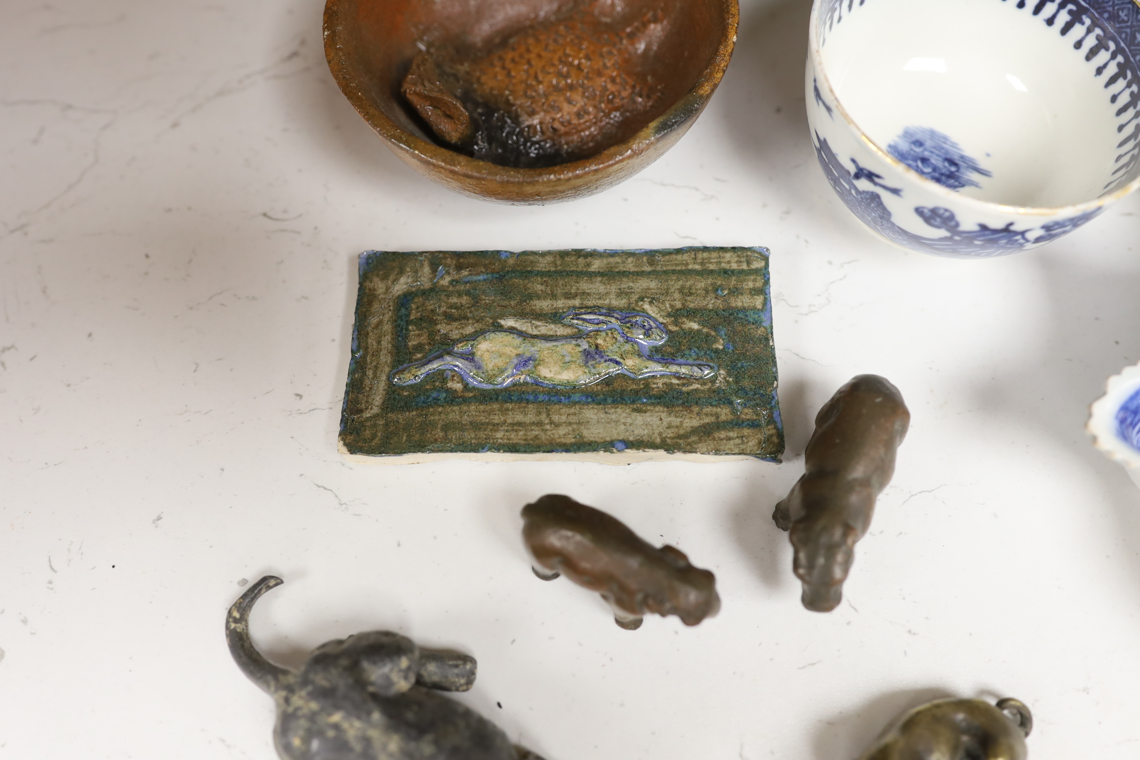 An early 20th century Viennese cold painted bronze figure of an African grey parrot, two 18th century English coffee cups, a leaf shape pickle dish, Victorian pot lid, other metal animal figures, a Japanese small carved
